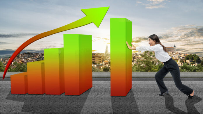 Asian businesswomen pushing increases graph
