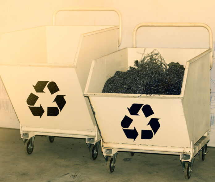 Mechanical industry metal waste. Steel shavings from CNC for recycling.